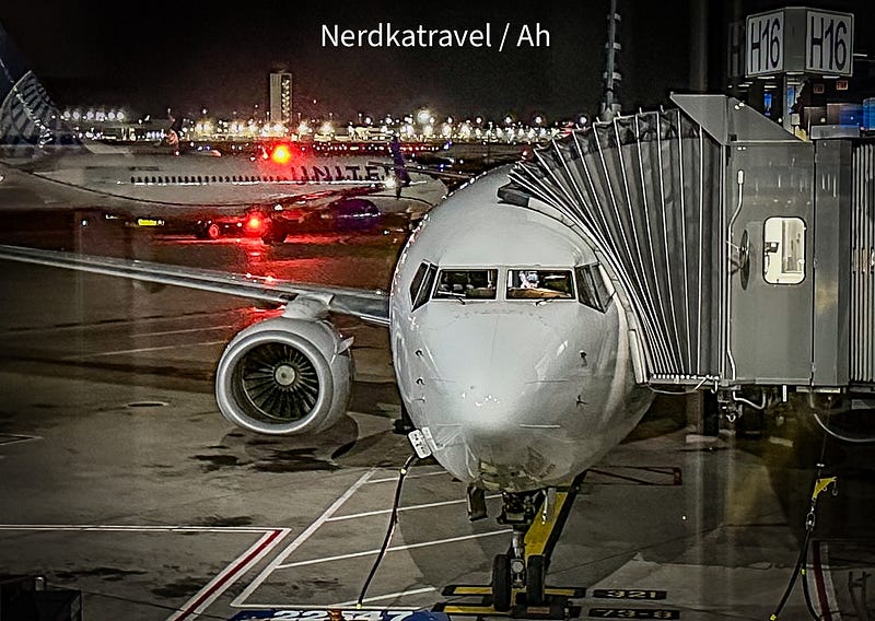 a white airplane on a runway