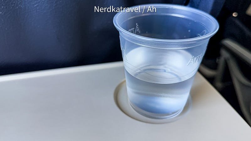 a clear plastic cup with clear liquid in it