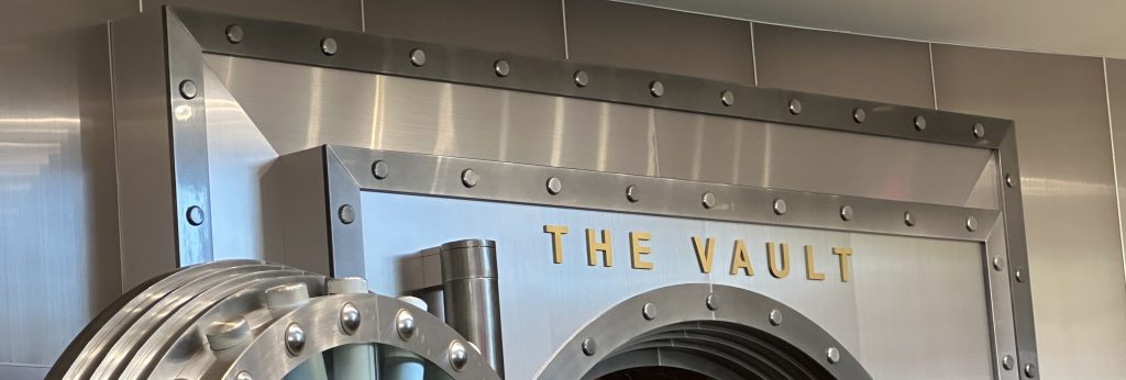 a metal arch with gold letters