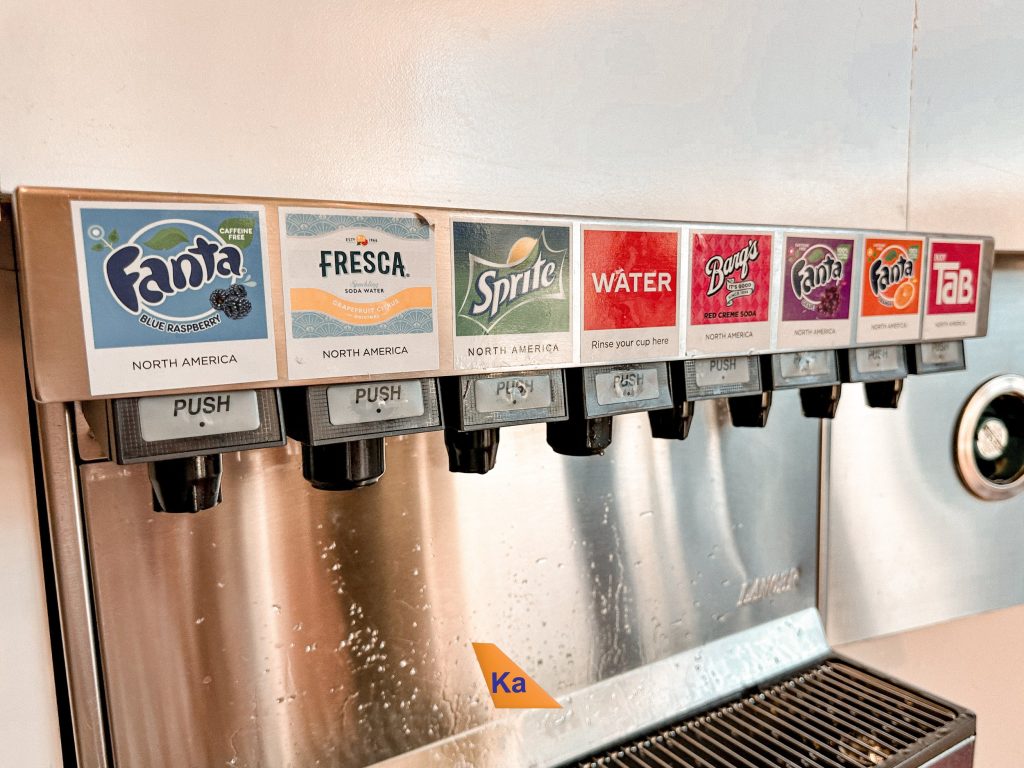 a group of soda dispensers