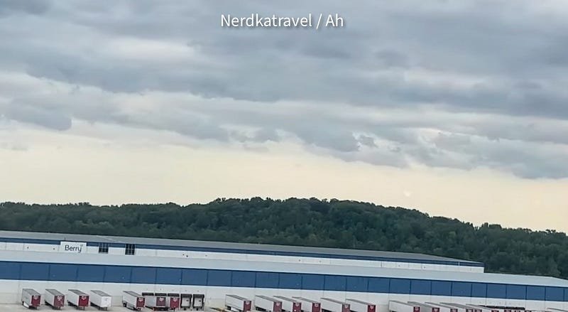 a building with trees in the background