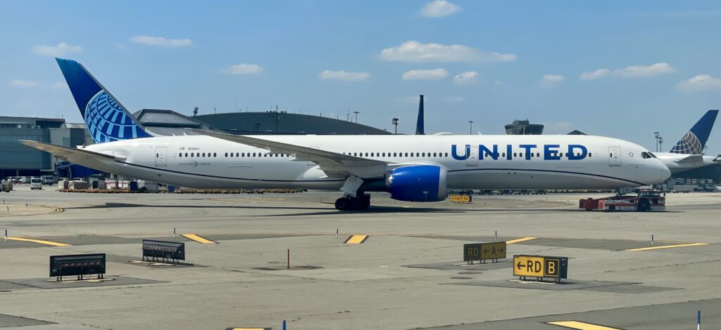 a white airplane on a runway