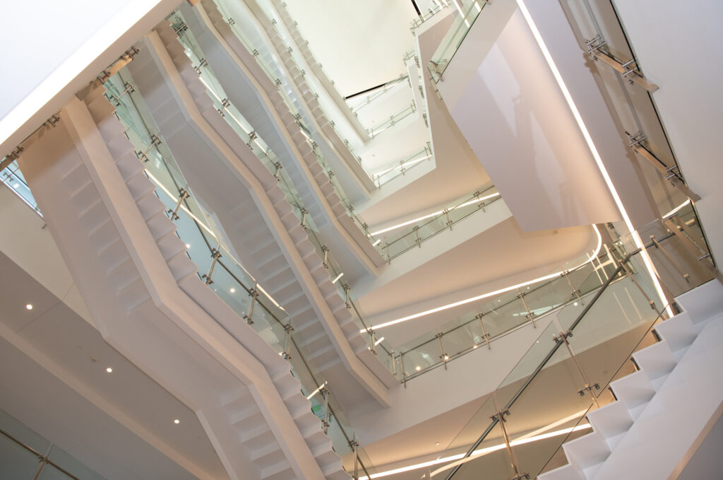 a staircase with glass railings