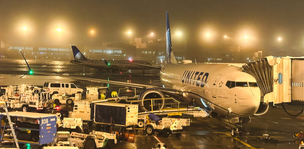 a group of airplanes at an airport