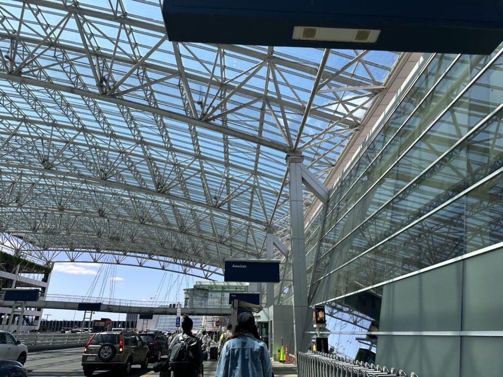 a group of people walking in a terminal