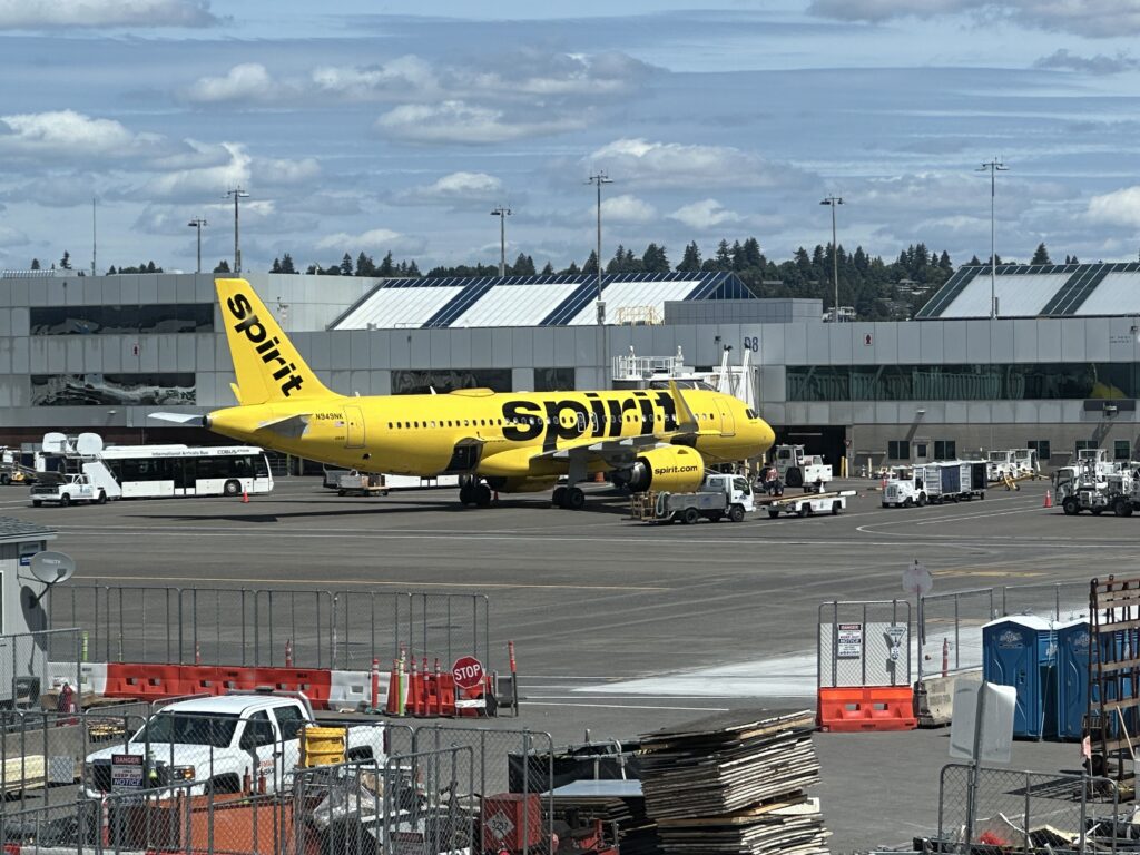 a yellow airplane on a tarmac