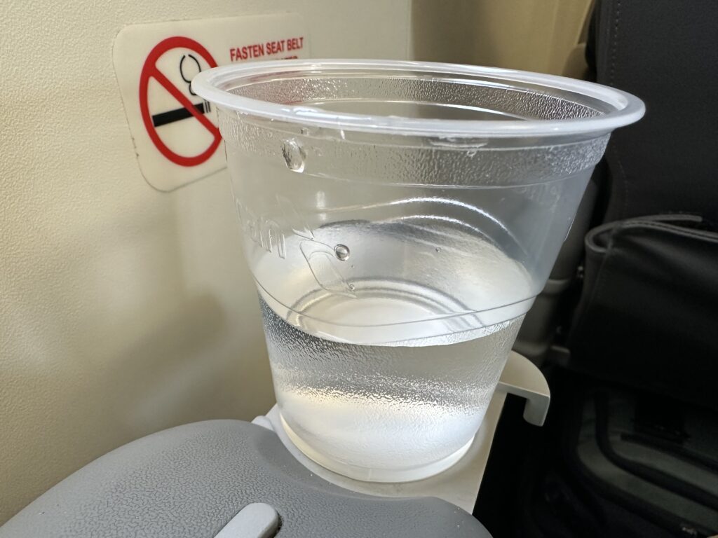 a plastic cup with clear liquid in it