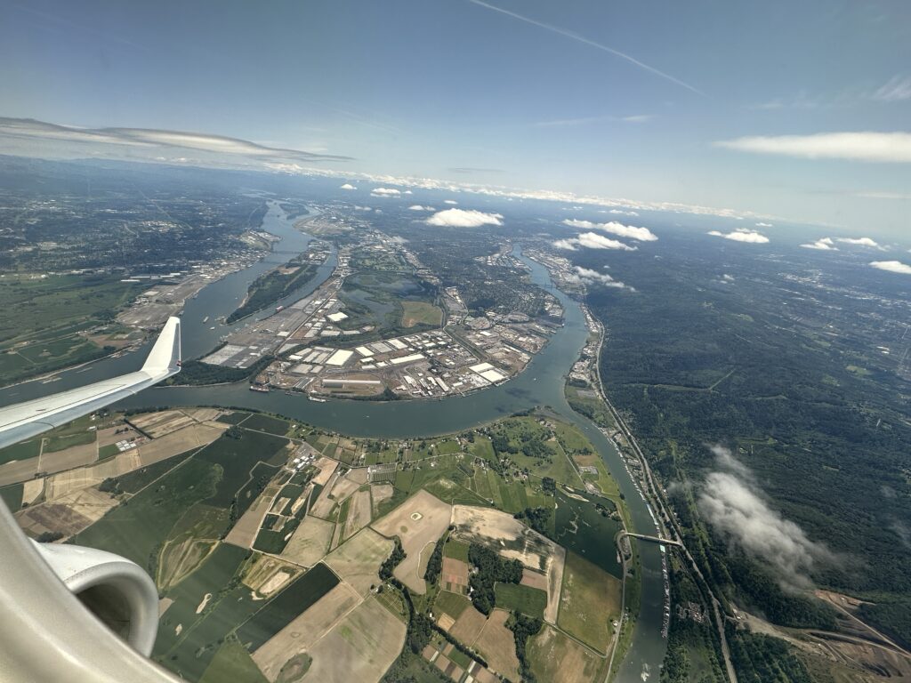 an aerial view of a river and a city