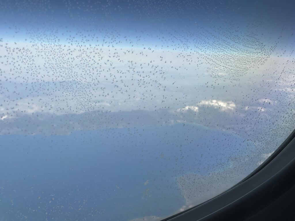 a view of clouds and sky from an airplane window