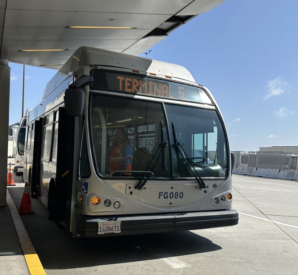 a bus under a bridge