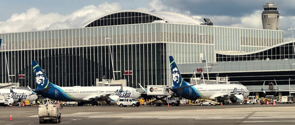 airplanes parked in front of a building