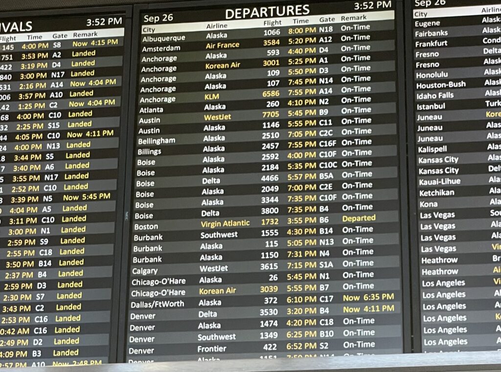 a board with a flight schedule