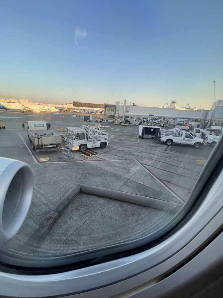 a view of a plane from a window of an airport