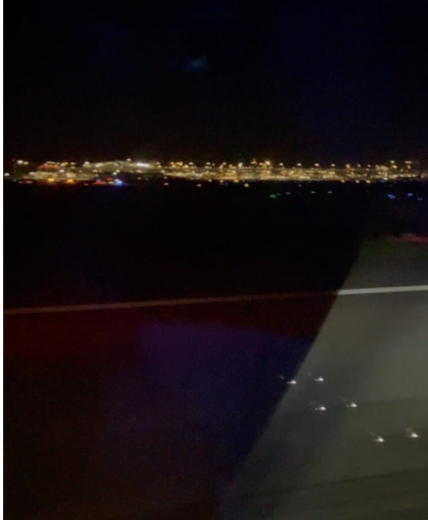 a city at night from a plane