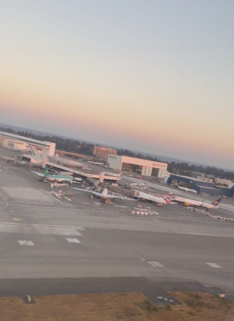 an airport with airplanes on the ground